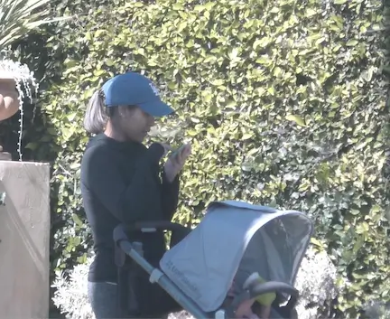a nanny walking with child in stroller observed during a child custody investigation