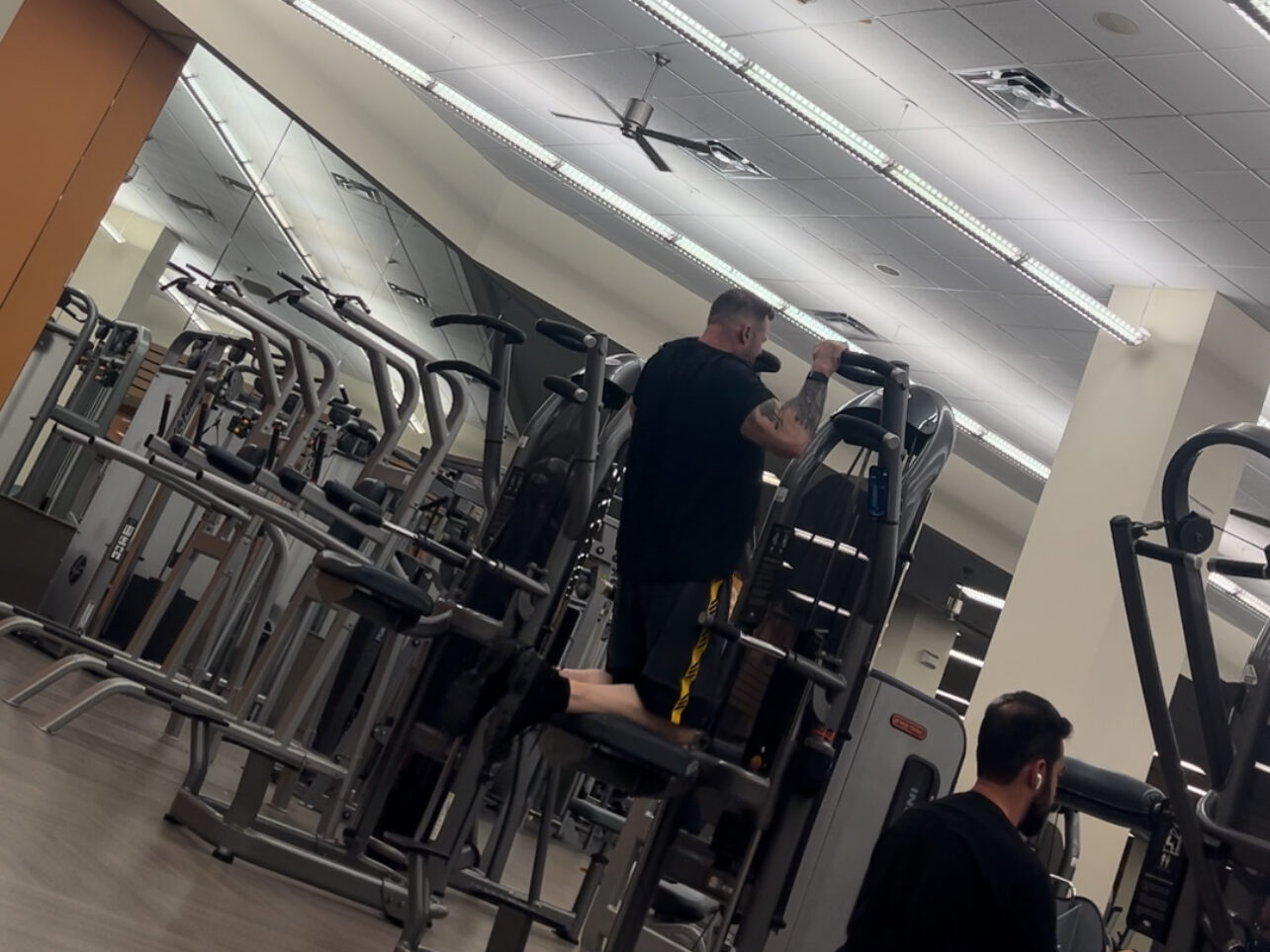 person suspected of workers compensation fraud working out inside of a gym