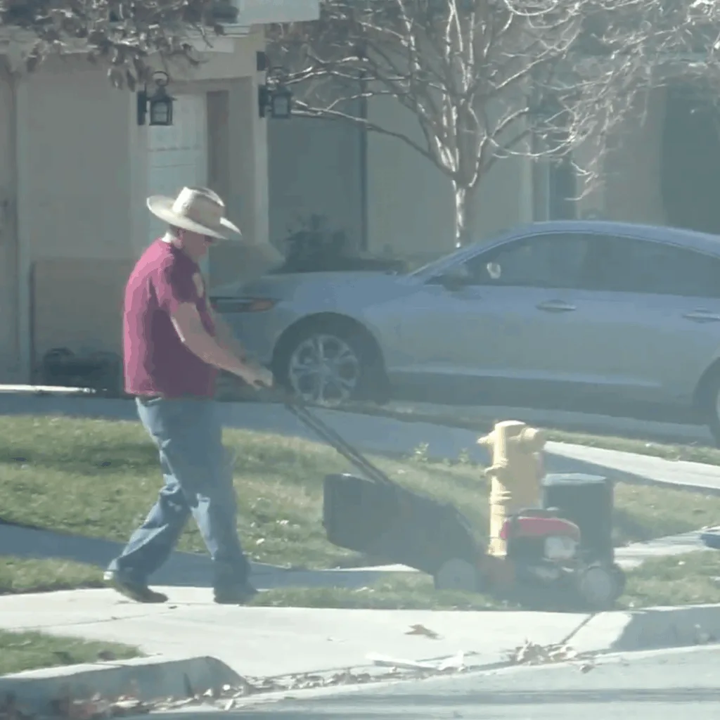 Claimant mowing the lawn during workers comp surveillance