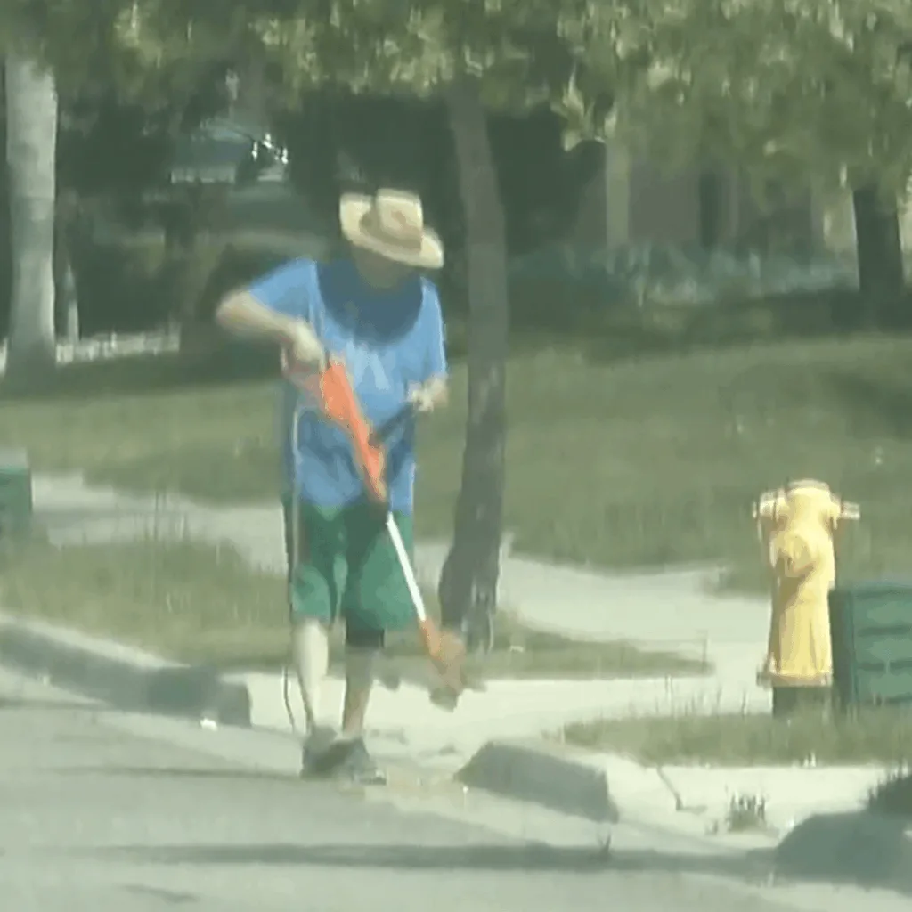 Claimant using a weed whacker during workers compensation surveillance