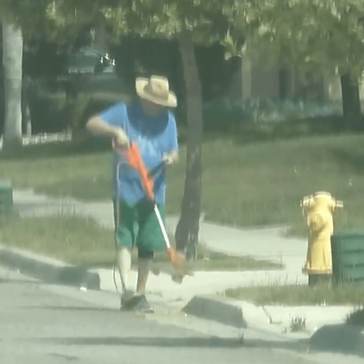 Claimant using a weed whacker during workers compensation surveillance
